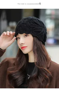 Elegant black mohair knit beanie with floral pattern worn by a model in winter
