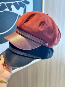 Detailed view of women's suede and PU leather baker boy hat showing material texture
