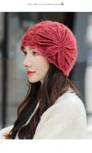 Side view of elegant red mohair knit beanie with large flower detail