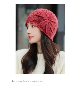 Side view detail of elegant red mohair knit beanie with large crochet flower pattern