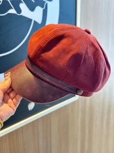 Stylish maroon newsboy cap with soft faux suede body and PU leather brim for women.