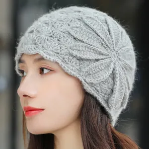 Elegant gray knit beanie for women featuring a large crochet flower pattern and soft mohair texture