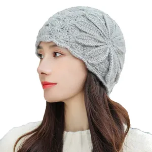 Elegant grey knitted floral beanie hat for women featuring warm mohair texture design.