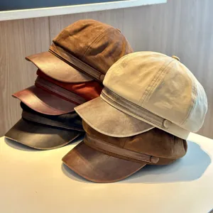 Stylish women's newsboy caps featuring suede fabric and a PU leather brim in earthy tones