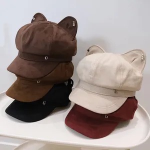 Detail view of cute cat ear newsboy caps in various colors with metal G hardware