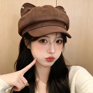 Detailed shot of a sweet brown baker boy hat featuring cute cat ears and soft texture
