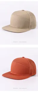 Detailansicht der atmungsaktiven Mesh-Baseballkappen in Khaki und leuchtendem Orange