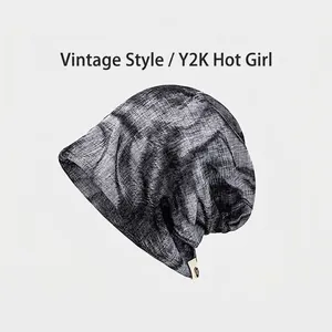 Detail view of the vintage leopard print texture on a lightweight slouchy beanie.