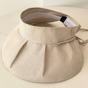 Foldable wide brim sun visor hat for outdoor UV protection in minimalist beige
