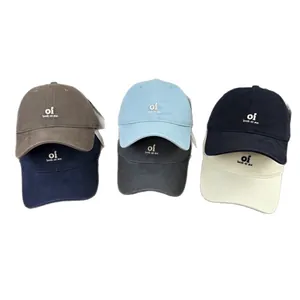 Six embroidered baseball caps in various colors including blue, brown, and black.