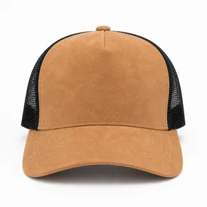 Detailed front view of a brown suede trucker hat with breathable black mesh back.