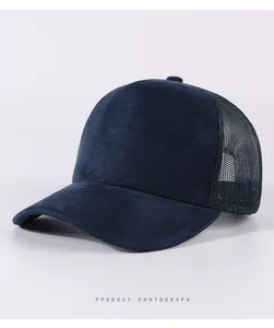 Detail view of navy blue suede and mesh trucker cap with professional stitching details