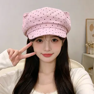 Vintage pink newsboy hat with black polka dots and cat ear design for stylish women