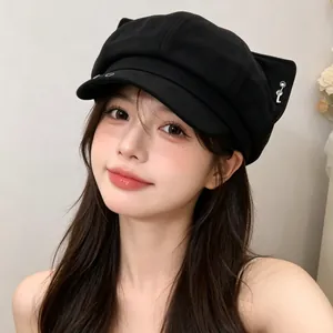Stylish black newsboy cap with cute fox ears and silver pendant detail for women