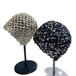Hand-knitted vintage sequin beanies in gold and black, stylish mesh crochet headwear.