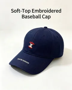 Close-up of navy blue baseball cap with apple core embroidery and YOUTH DAYOFF text.