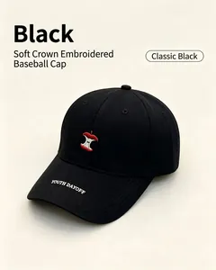 Detailed view of black baseball cap with embroidered red apple core and YOUTH DAYOFF text