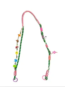 Detail of colorful woven crossbody phone lanyard with 'EXPLORE' letter beads