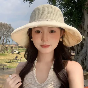 Detail view of a breathable mesh sun hat with elegant crystal embellishments for women