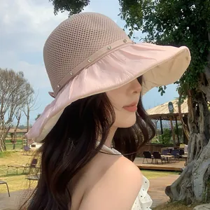 Close-up of pink sun hat with breathable mesh and rhinestone brim detailing