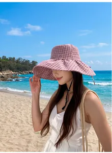 Fashionable pink plaid wide-brim sun hat for beach vacations and sun protection