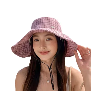 Stylish Korean pink plaid bucket hat featuring a wide brim for summer sun protection