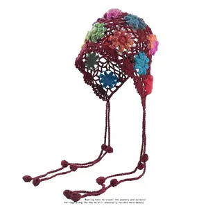 Handmade crochet floral beanie with long tassels in bohemian hollow knit style