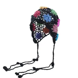 Handmade crochet floral hollow-out beanie with long tassels and bohemian ethnic style