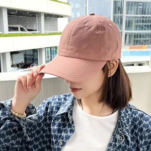 Close-up of quick-dry baseball cap in pink on female model