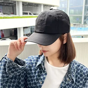 Detailed side view of a black quick-dry soft-top baseball cap for outdoor sports women.