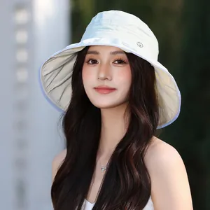 Elegant women's pleated sun hat with wide brim for outdoor leisure activities in mint