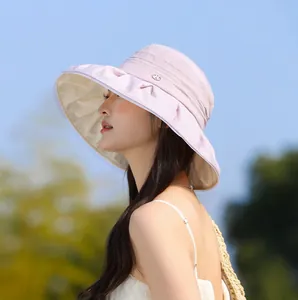Detail view of an elegant pleated lavender sun hat for women featuring a wide brim design