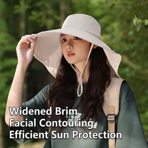 Close-up detail of a beige wide-brim sun hat with neck protection flap and adjustable chin strap