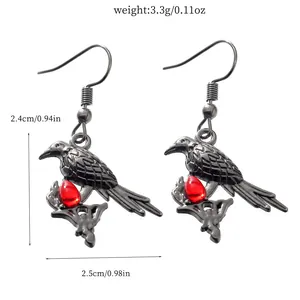Detailed view of Gothic black raven earrings with red teardrop gem and dimensions.
