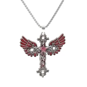 Detailed view of gothic winged cross necklace with a luminous pink star pendant