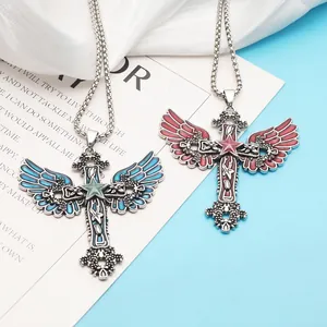Detail view of gothic luminous cross pendants with angel wings in blue and red finishes