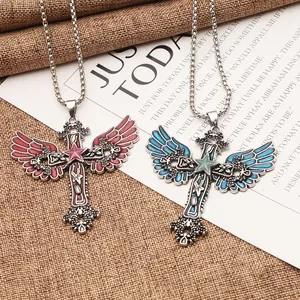 Detail shot of gothic luminous pentagram angel wings cross necklaces in red and blue