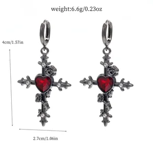 Detailed view of Gothic cross earrings featuring a red heart and thorn rose, 4cm length