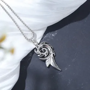 Detailed close-up view of a vintage silver gothic hollow swirl pendant necklace