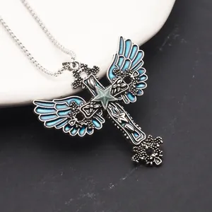 Close-up of a gothic noctilucent cross pendant featuring blue angel wings and a star design.