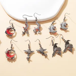 Gothic punk earring set featuring crow moon and red resin pendants for spicy girl style