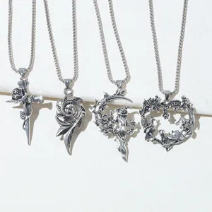 Group of vintage gothic silver necklaces featuring witch moon and mushroom heart designs