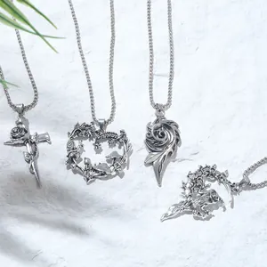 Detailed close-up view of gothic mushroom heart and witch moon pendant silver necklaces