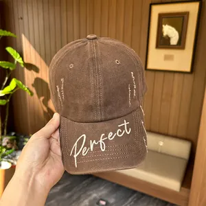 Distressed brown cotton baseball cap featuring white 'Perfect' script embroidery
