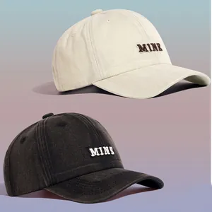 Cream and charcoal washed cotton baseball caps with unisex MINE embroidery detail