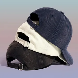 Back view of washed cotton baseball caps with adjustable metal buckles in multiple colors