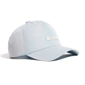 Side view of a light blue washed cotton baseball cap with MINE letter embroidery details