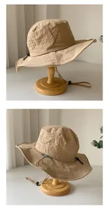 Breathable khaki quick-dry outdoor sun hat with adjustable wind strap, detailed view