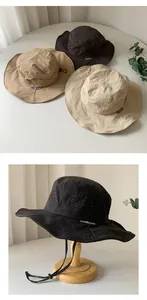 Detail view of breathable quick-dry sun hats in khaki, black, and beige.