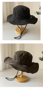 Quick-dry breathable bucket hat with ventilation holes and adjustable chin strap